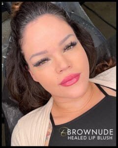 Woman with freshly healed lip blush tattoo, showcasing natural-looking lip enhancement.